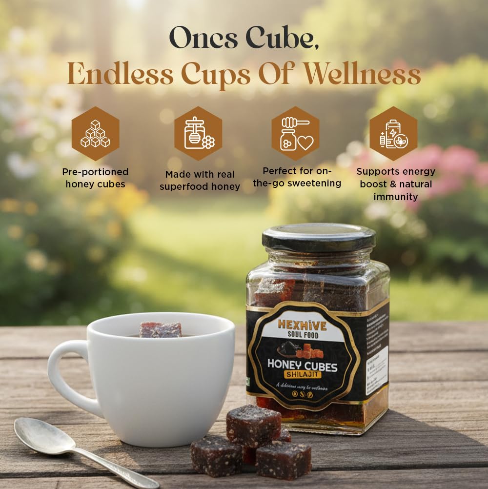 Jar of honey cubes with a cup and spoon on a wooden surface, featuring text about 'Ones Cube' product.