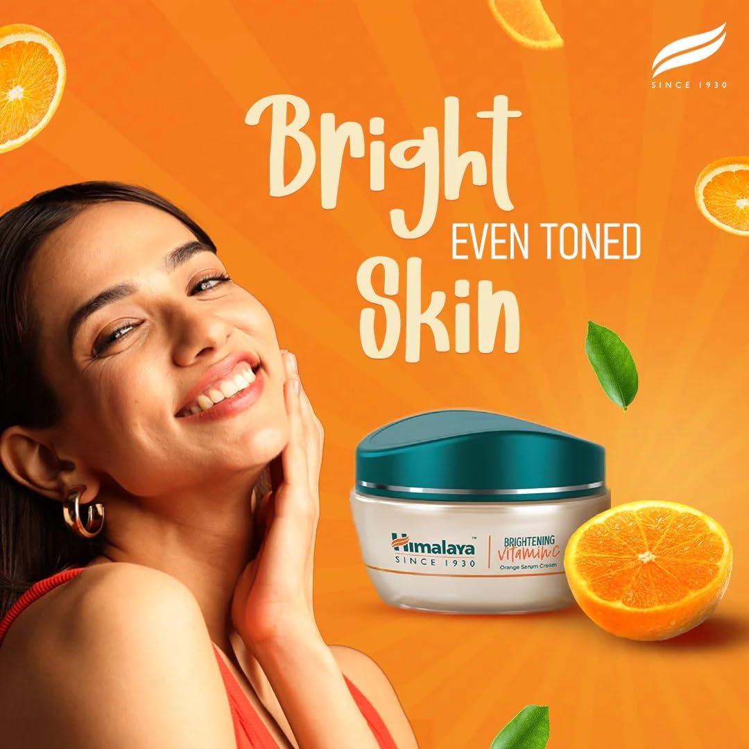 Himalaya Brightening Vitamin C cream with a woman and oranges on an orange background