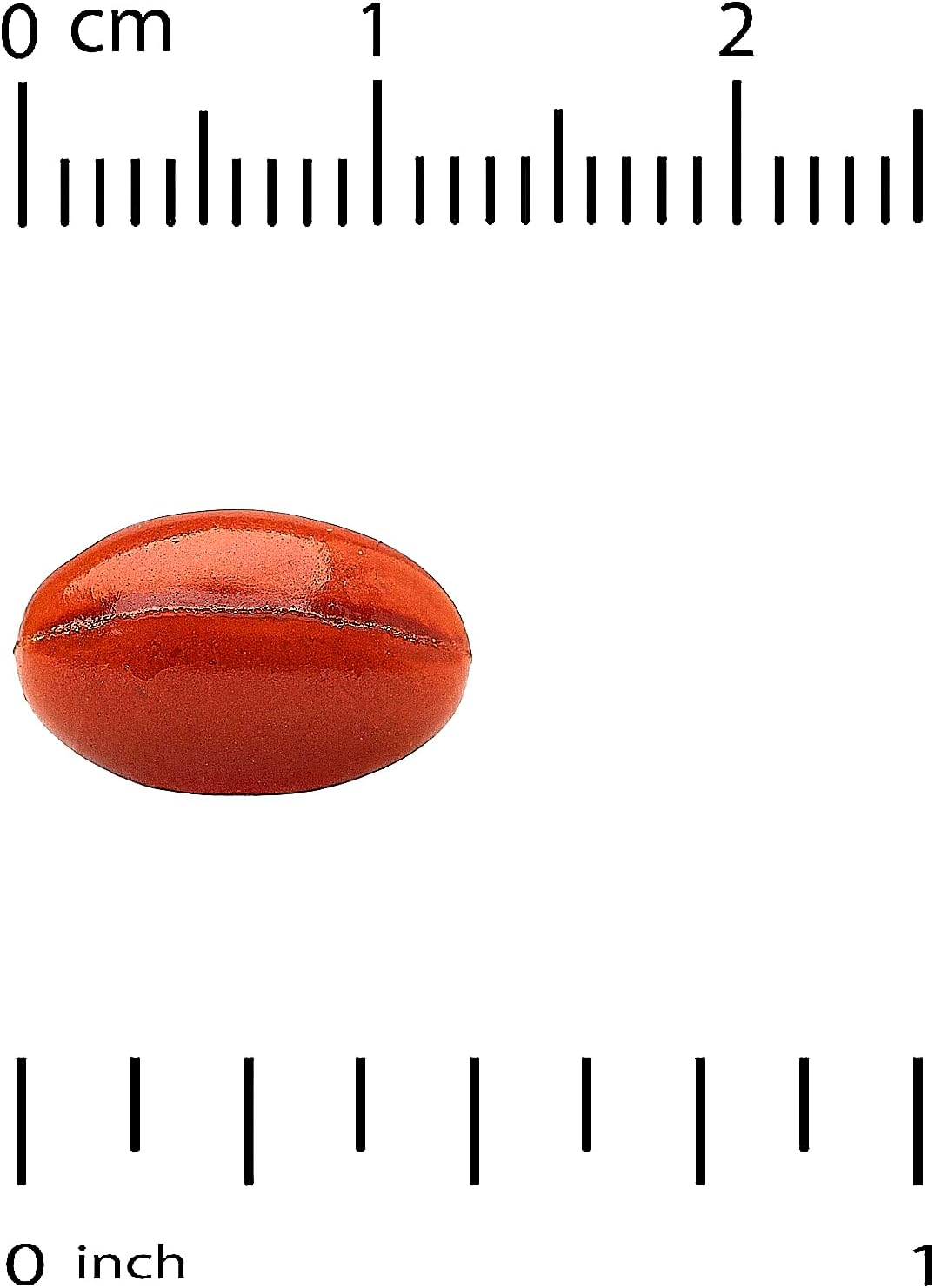 Red stone with a ruler showing its measurement in centimeters and inches
