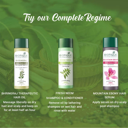 Biotique hair care products with usage instructions on a green leafy background