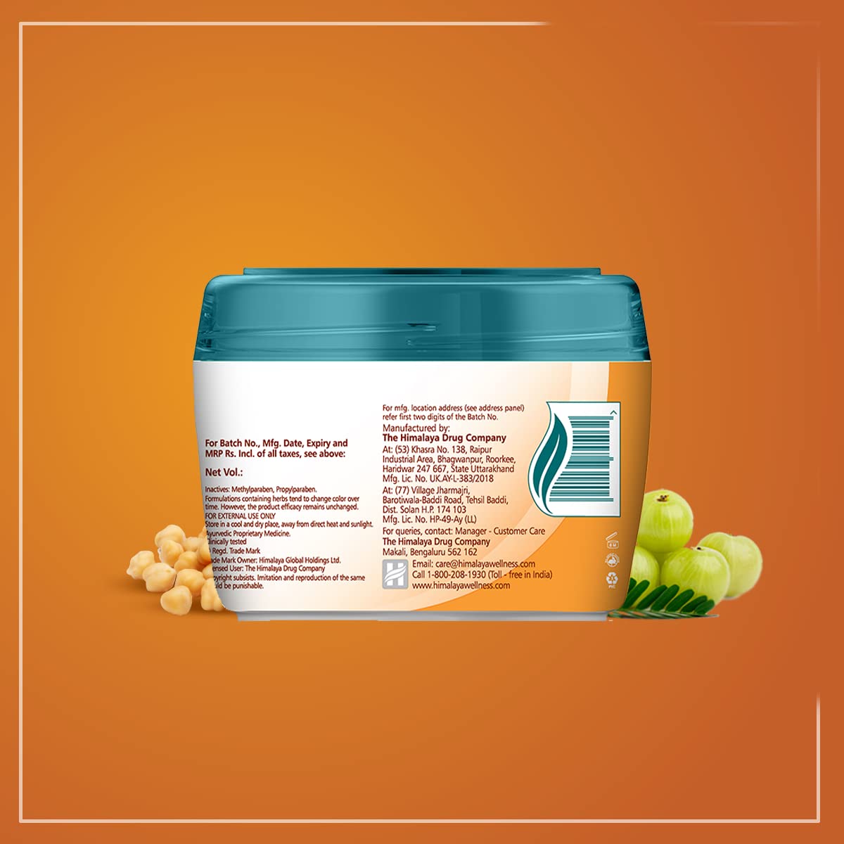 Jar of a product with a blue lid on an orange background