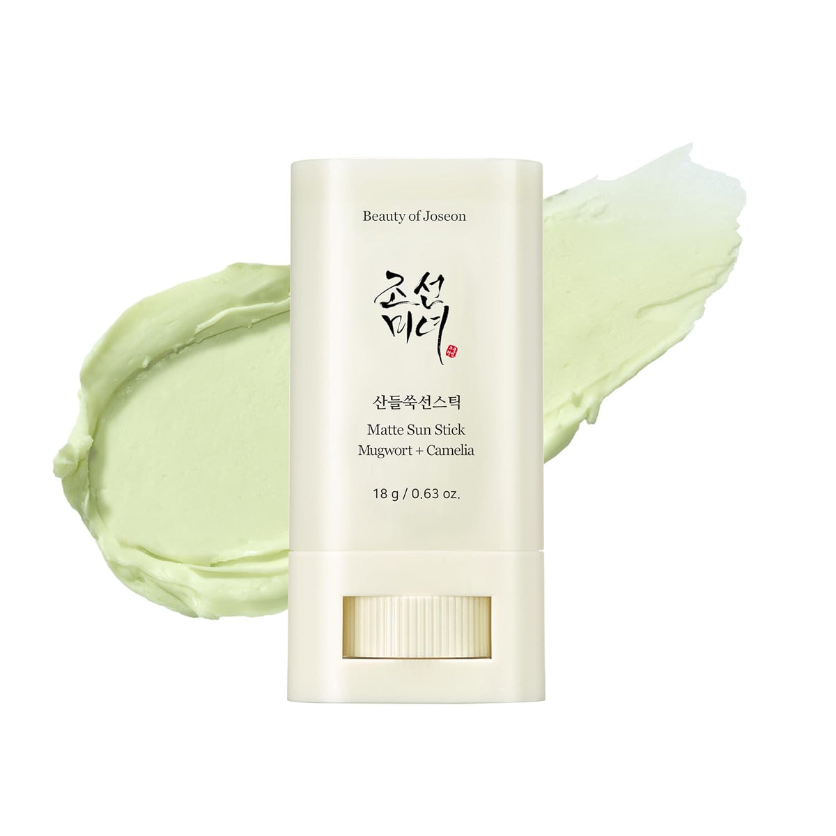 Beauty product with green cream swatch on a white background
