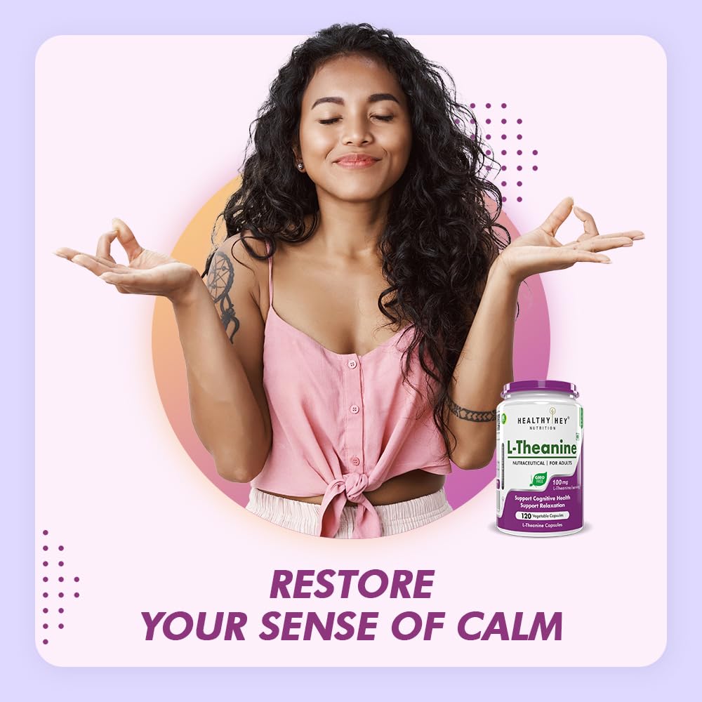 Woman in pink top with L-Theanine supplement bottle on a light purple background