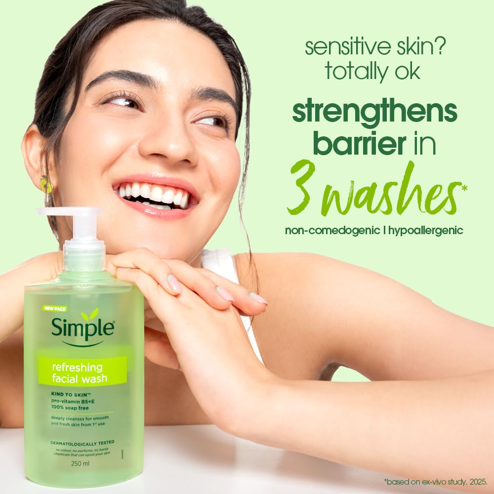 Woman holding a bottle of Simple refreshing facial wash with text about its benefits on a light green background
