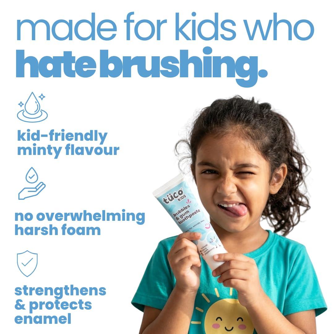 Child holding a tube of toothpaste with text about its features on a white background
