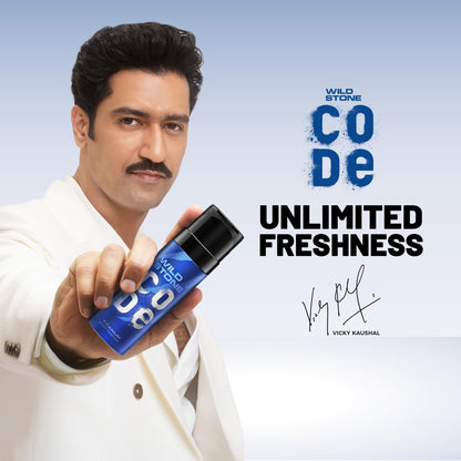 Man holding a Wild Stonedeo bottle with 'Code Unlimited Freshness' text on a light blue background