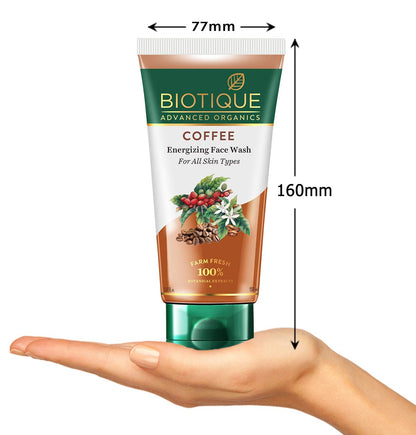 Biotique Coffee Energizing Face Wash tube with dimensions and a hand for scale on a white background