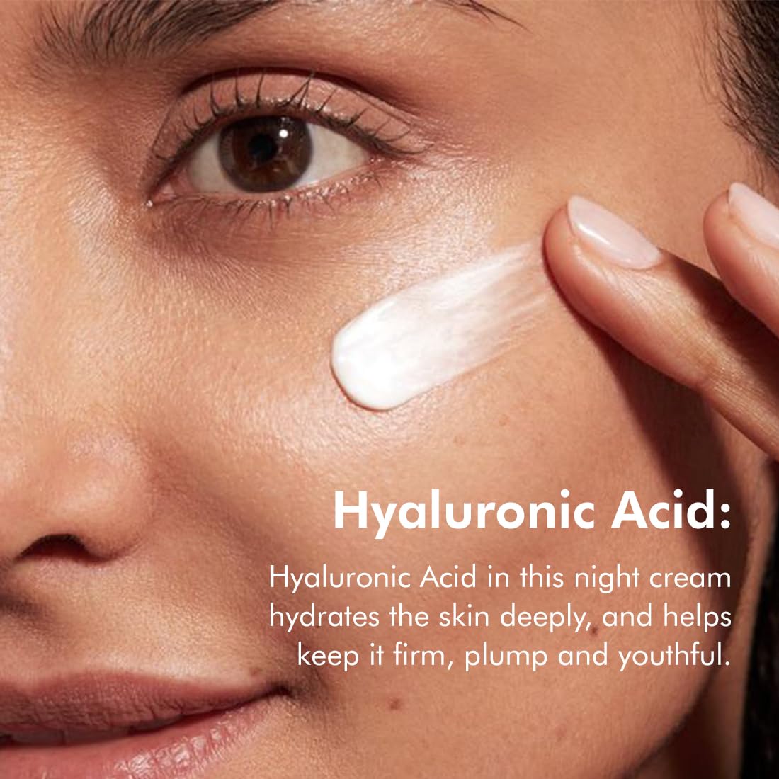 Woman applying night cream to her face with text about hyaluronic acid benefits.