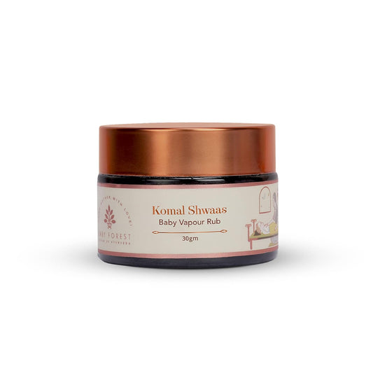 Jar of Komal Shwaas Baby Vapour Rub with a copper lid on a white background