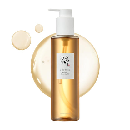 Gold bottle with white pump and label on a white background