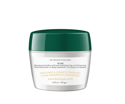 Skincare jar with green lid on a white background