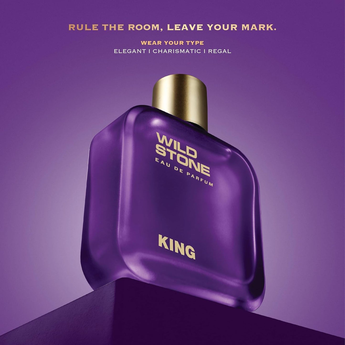 Purple perfume bottle labeled 'Wild Stone' with gold cap on a purple background.