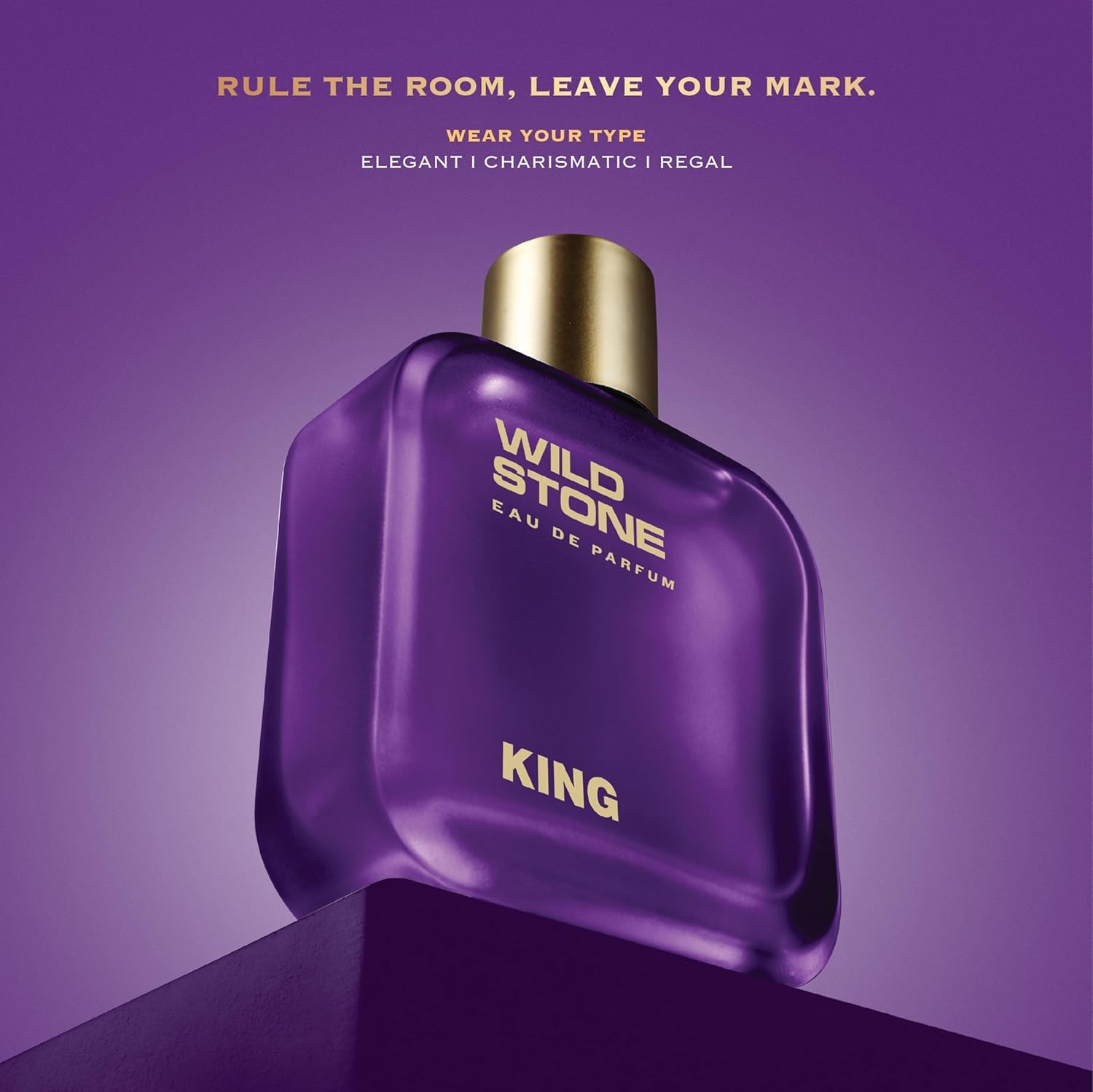 Purple perfume bottle labeled 'Wild Stone' with gold cap on a purple background.
