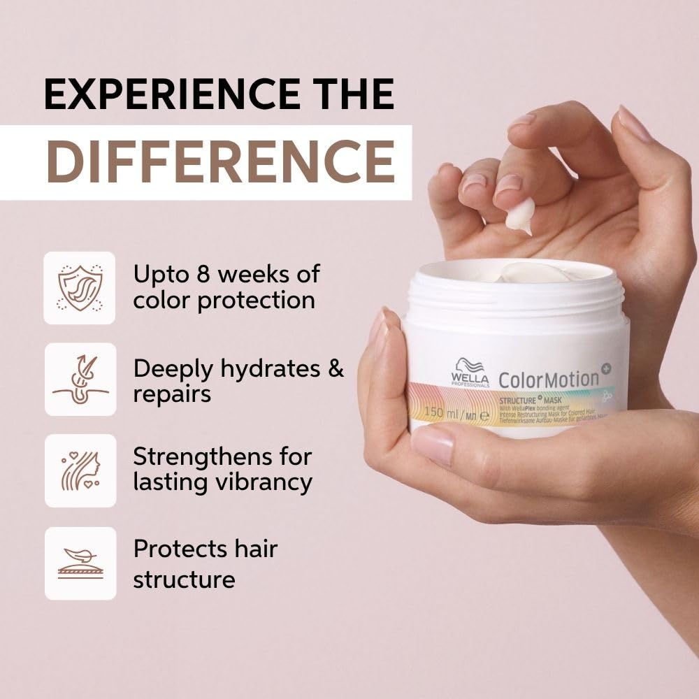 Hand holding a Wella ColorMotion+ hair mask jar with product benefits on a light pink background