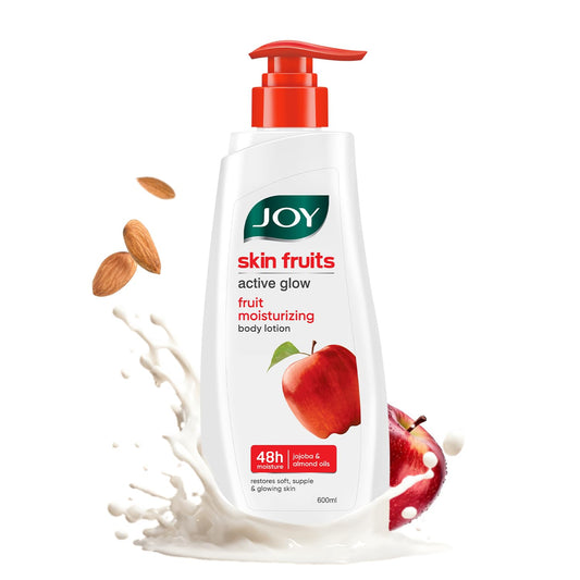 JOY skin fruits body lotion with apples and almonds on a white background