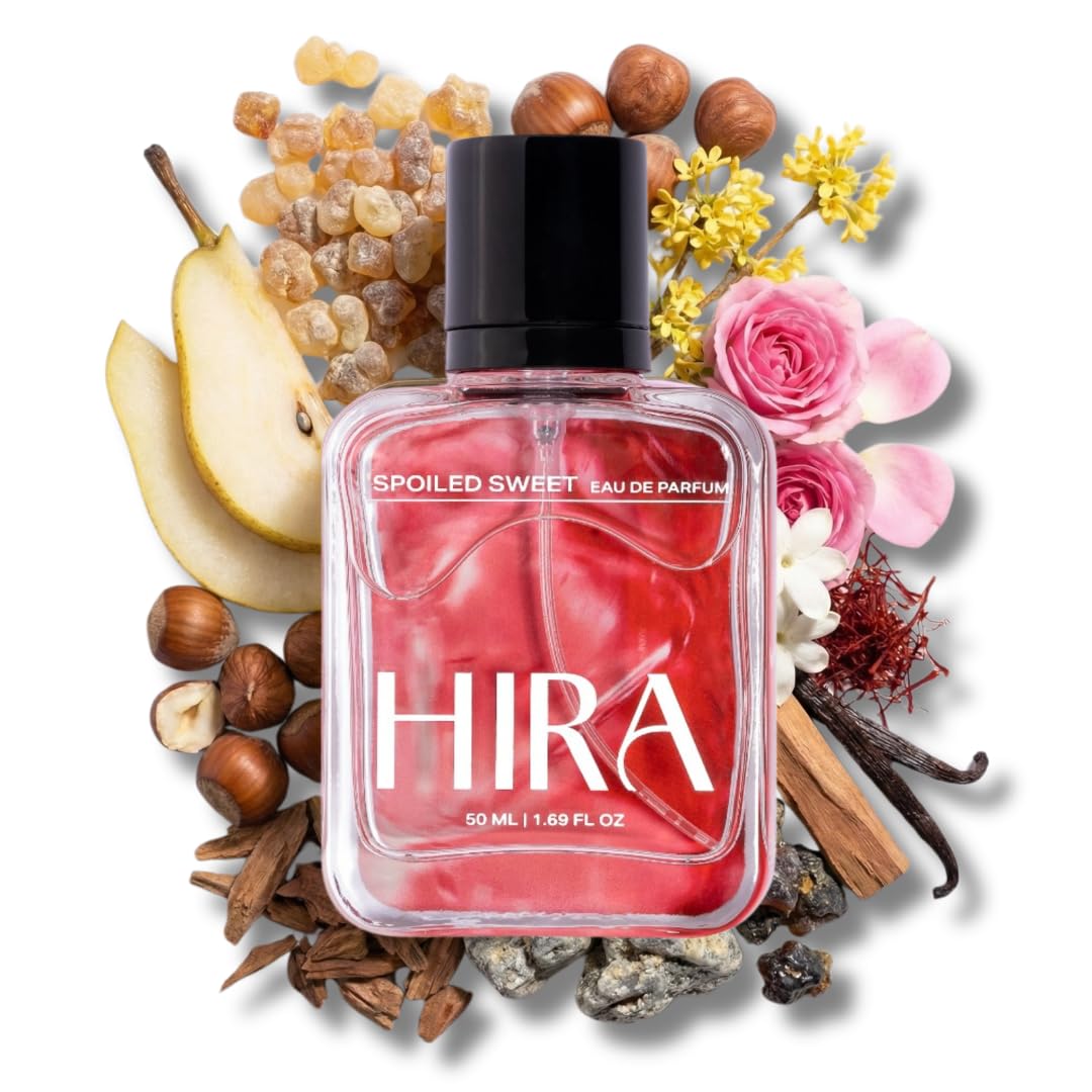 Perfume bottle labeled 'Hira' surrounded by flowers, fruits, and herbs on a white background