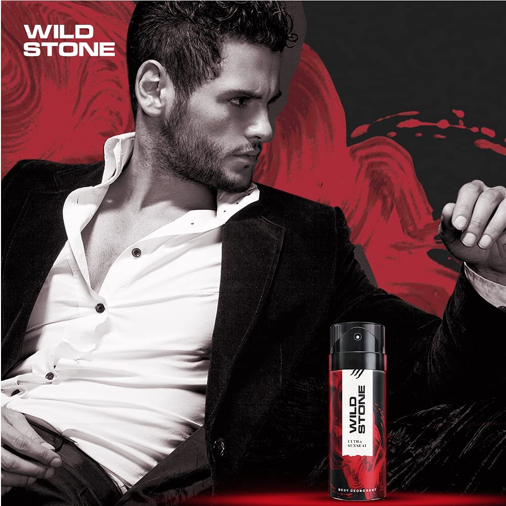 Man in formal attire with Wild Stone deodorant can on a red and black background