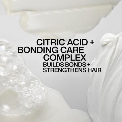 Text overlay on a close-up of a hair care product with text about citric acid and bonding care complex.