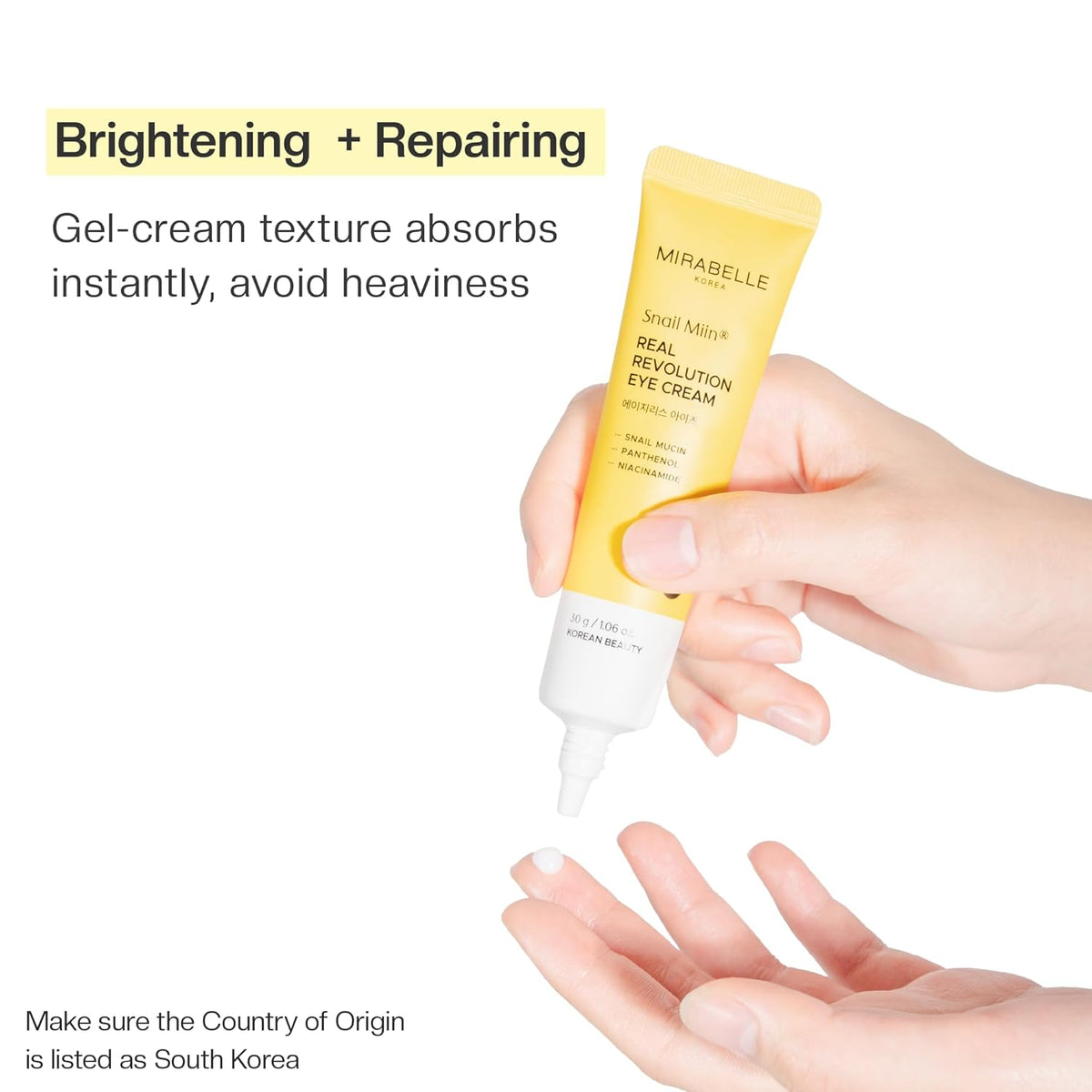 Yellow eye cream tube with text about brightening and repairing, held by a hand.