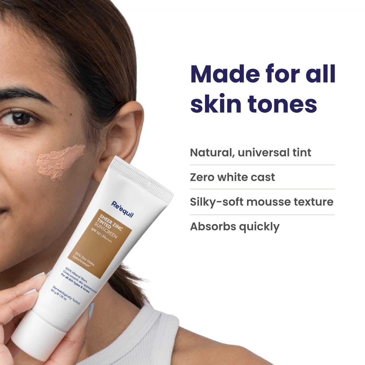 Woman holding a tube of makeup with text about skin tones and product features.