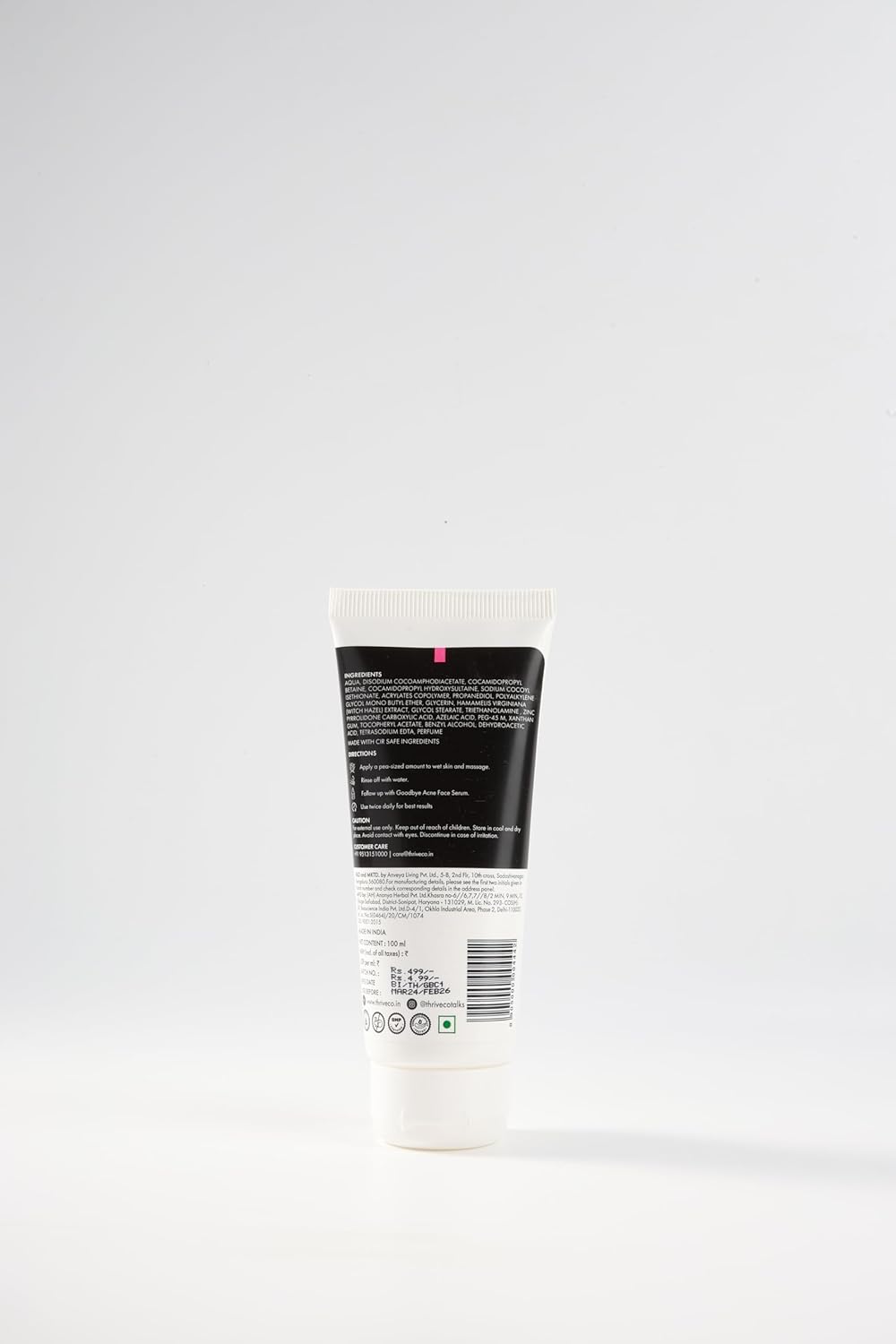 Tube of cream with a black label on a white background