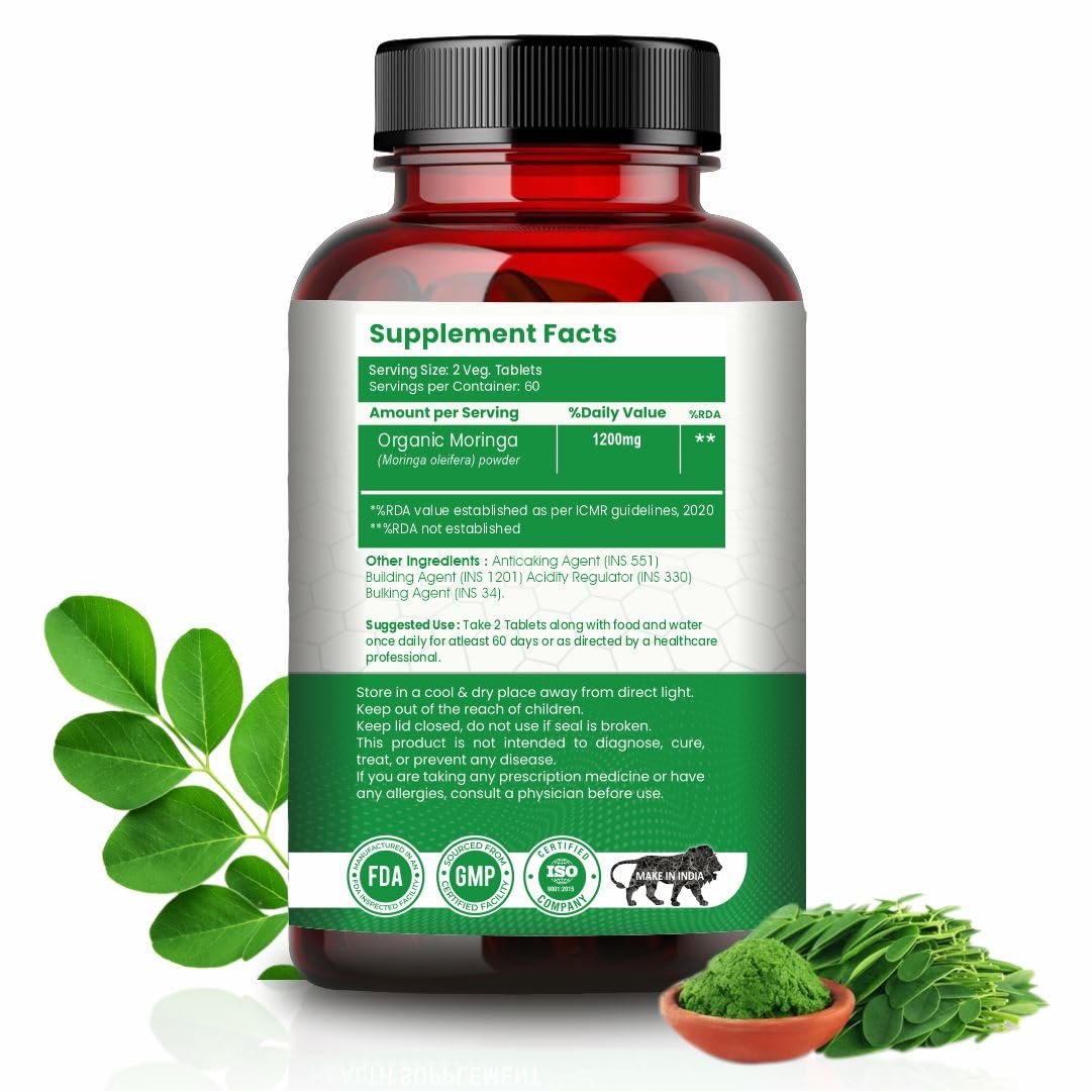 Supplement bottle with green label and moringa leaves on a white background
