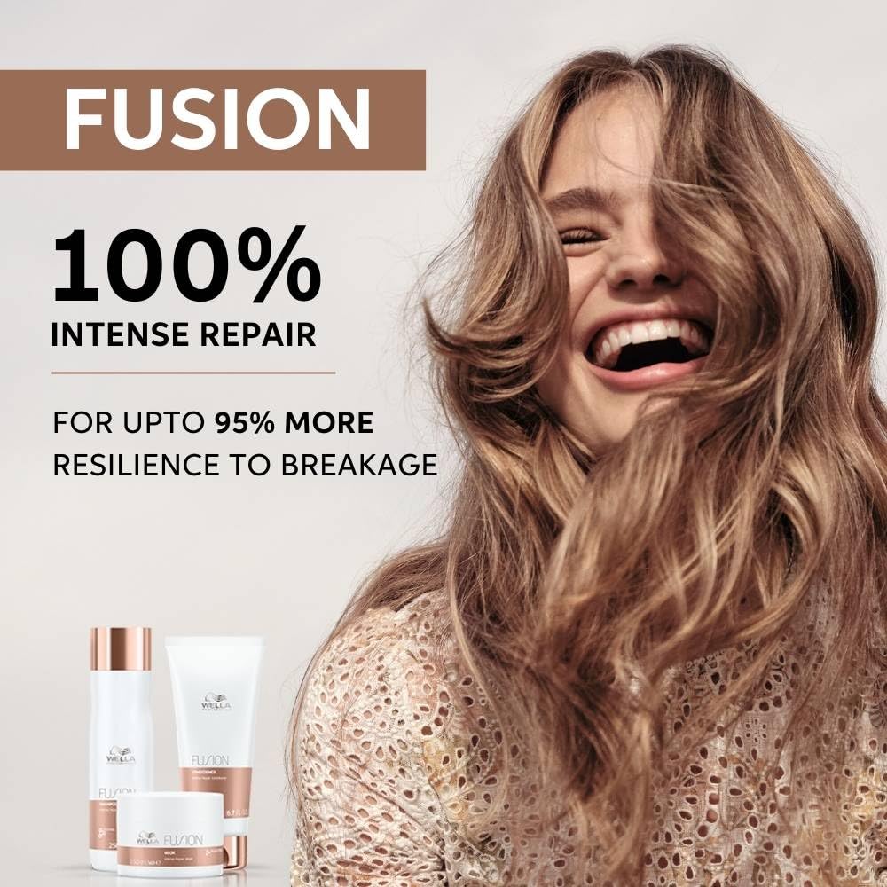Woman with long, wavy hair next to Fusion hair care products on a white background