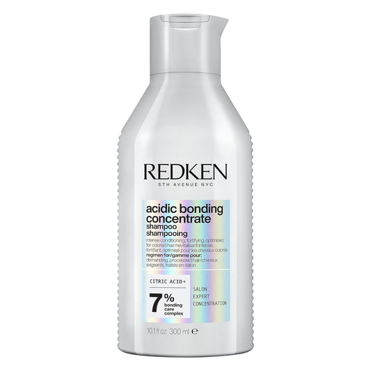 Redken acidic bonding concentrate shampoo bottle on a white background