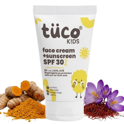 Tube of tüco Kids face cream and sunscreen SPF 30 with turmeric, saffron, and flowers on a white background