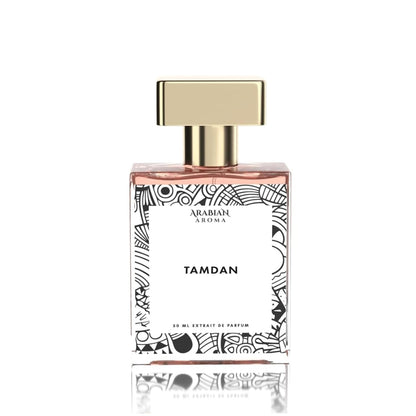 Perfume bottle labeled 'Tamdan' by Arabian Aroma on a white background