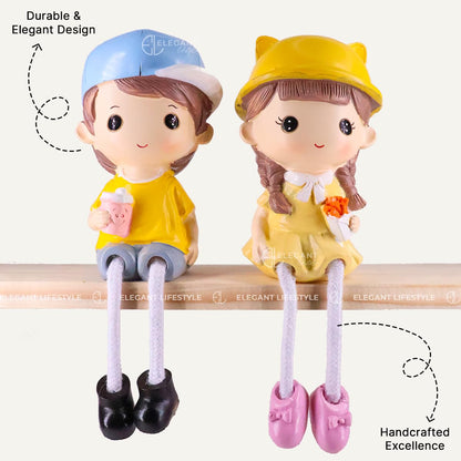 Kiss & Bouquet Gift Set Decorative Showpiece |Gift for him/her or Someone Special | Polyresin Couple Wearing Cute Caps Hanging Legs Showpiece - 2 Pcs Set