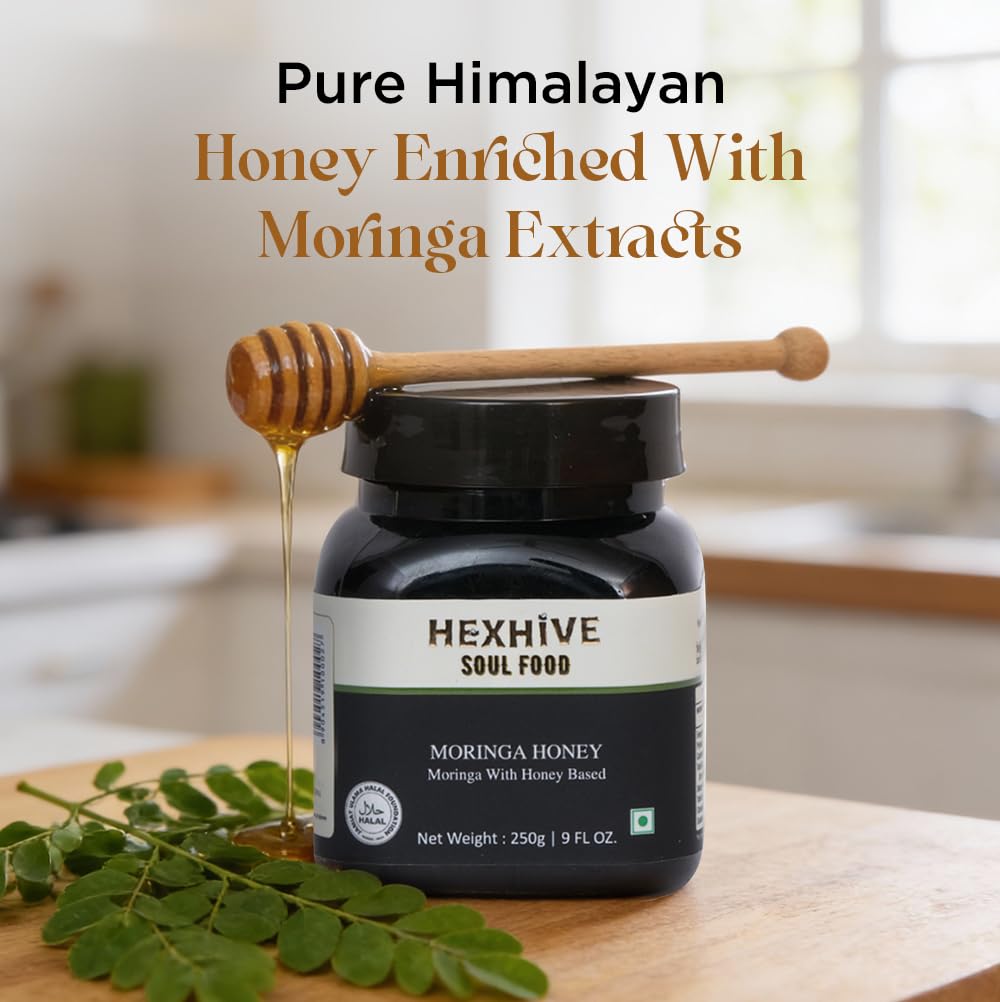 Hexhive Moringa Honey jar with honey dipper on a kitchen counter