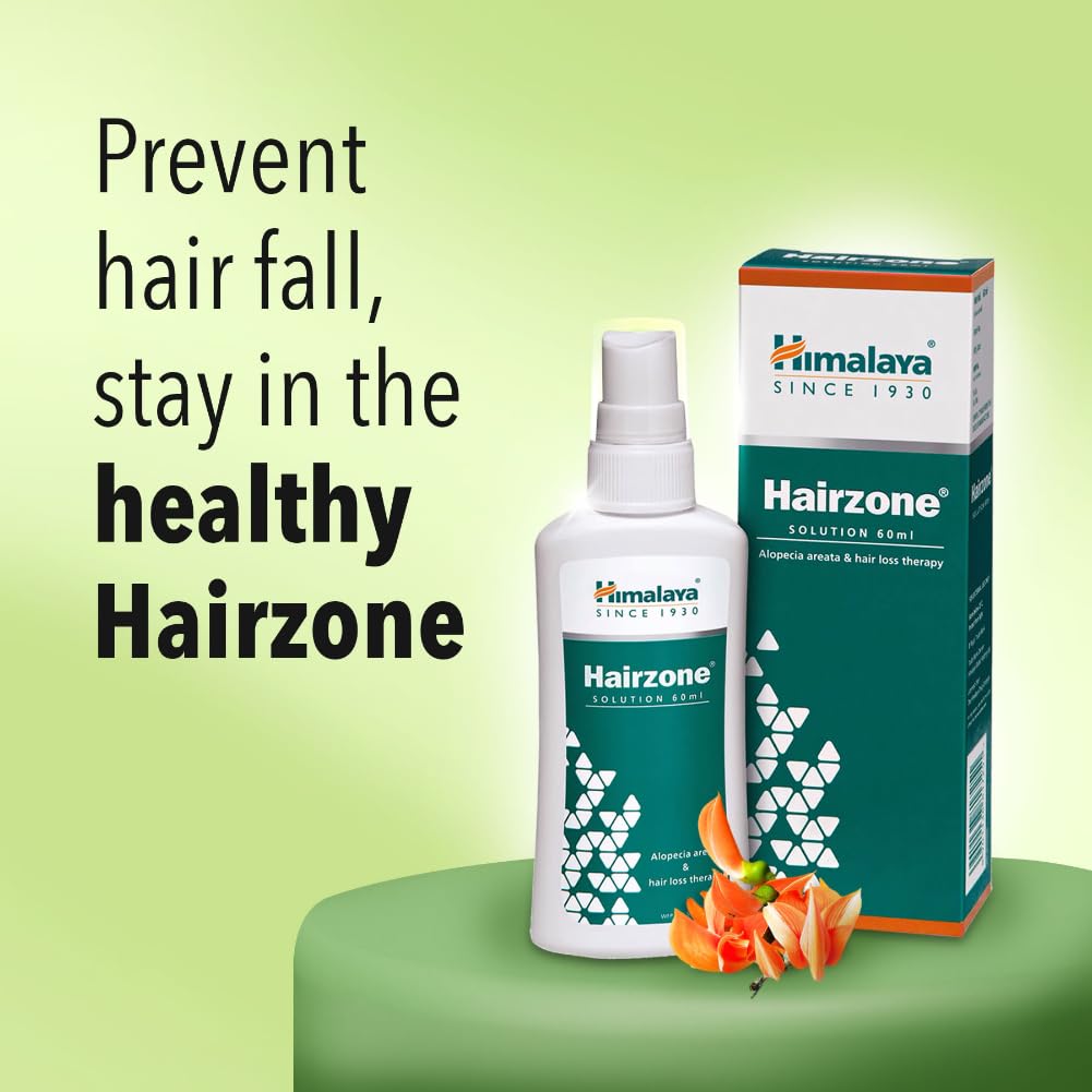 Himalaya Hairzone product with bottle and box on a green background