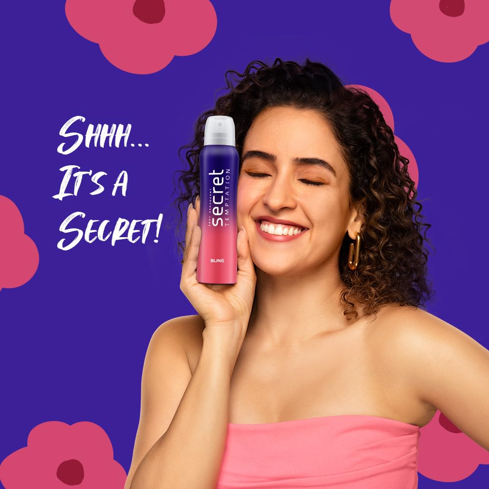 Woman holding Secret deodorant with pink flowers and purple background