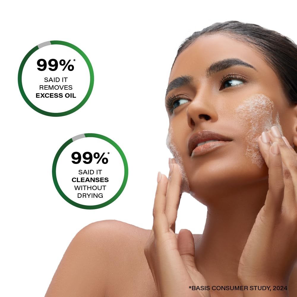 Woman applying facial cleanser with product effectiveness claims on a white background