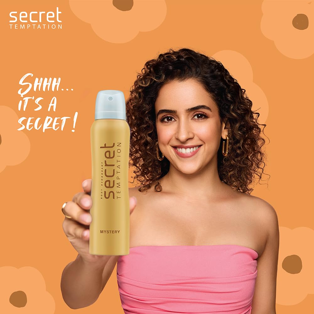 Woman holding a 'secret temptation' product with an orange background