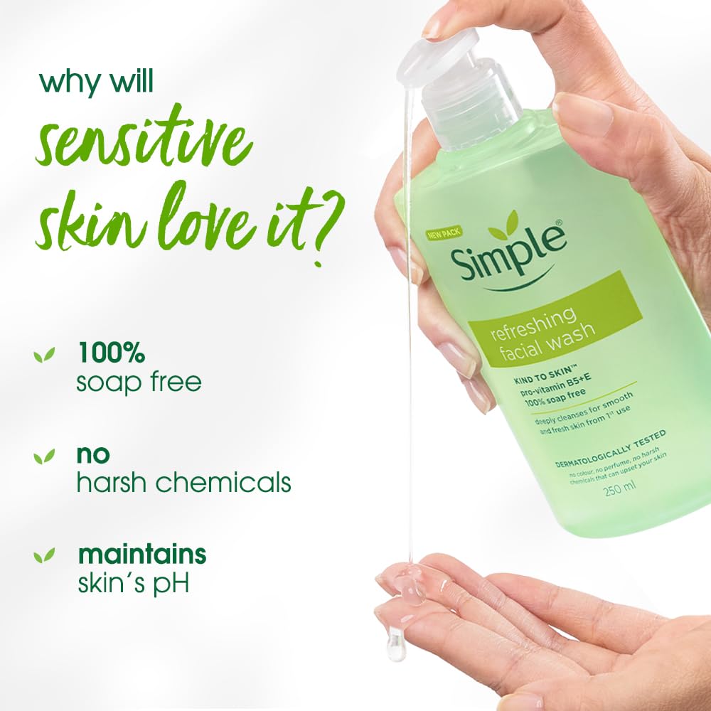 Hand holding a bottle of Simple refreshing facial wash with text highlighting benefits on a white background