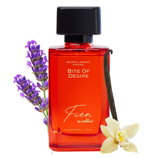 Red perfume bottle labeled 'Bite of Desire' by Fien with lavender and vanilla flowers on a white background