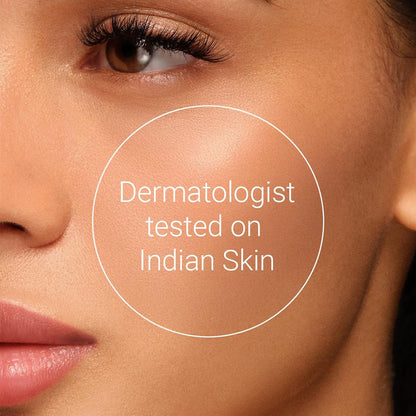 Close-up of a person's face with a dermatologist-tested on Indian skin label.