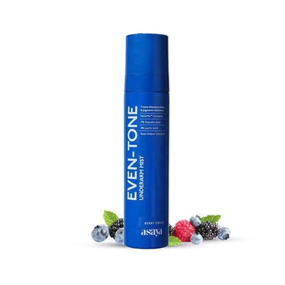 Blue skincare product bottle with berries on a white background