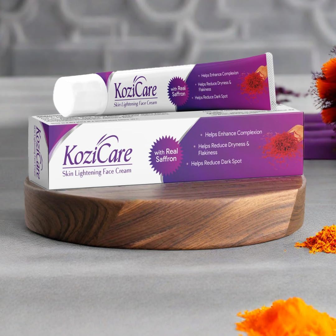 KoziCare skin lightening face cream packaging on a wooden stand with flowers in the background