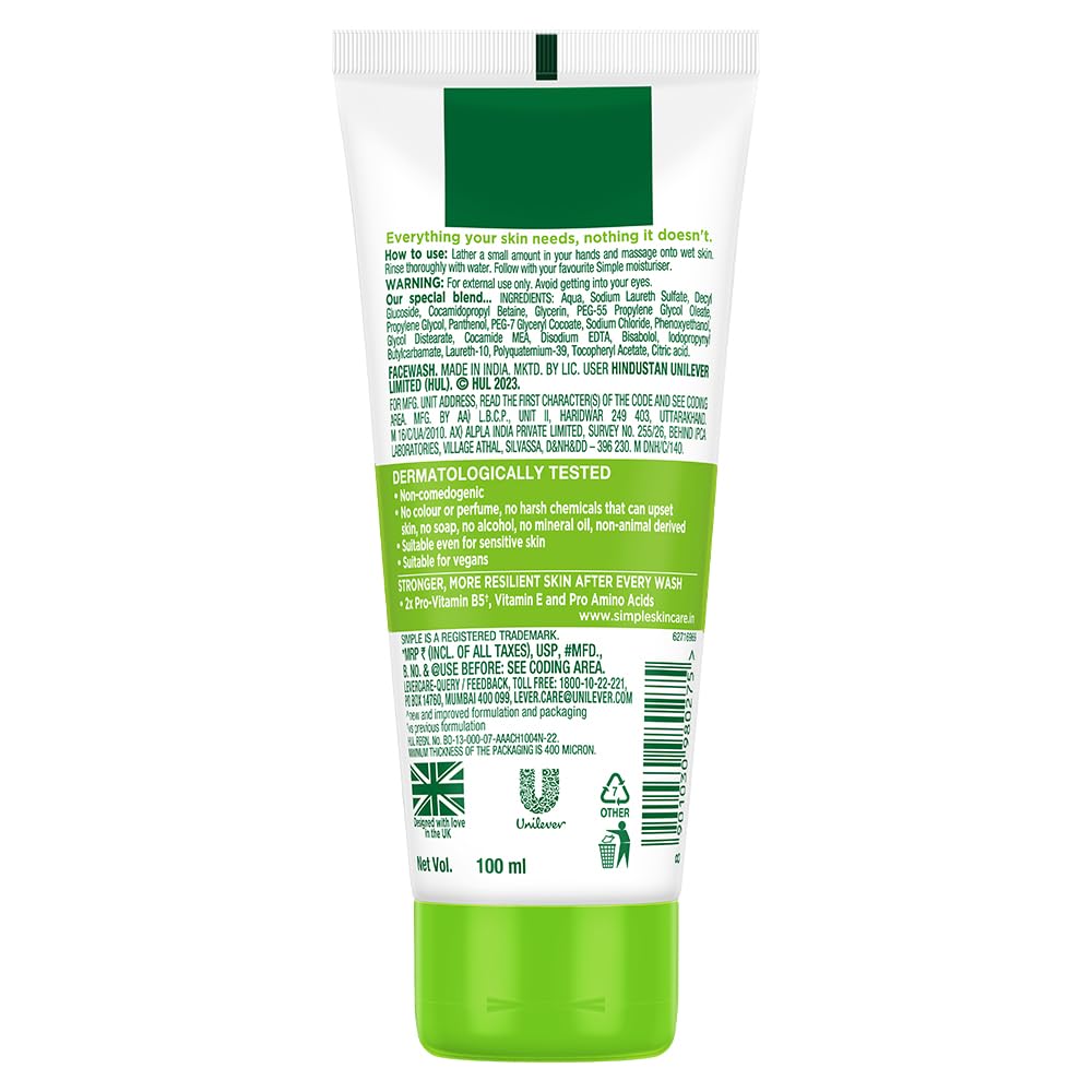 Back view of a green and white skincare product tube with text on a white background