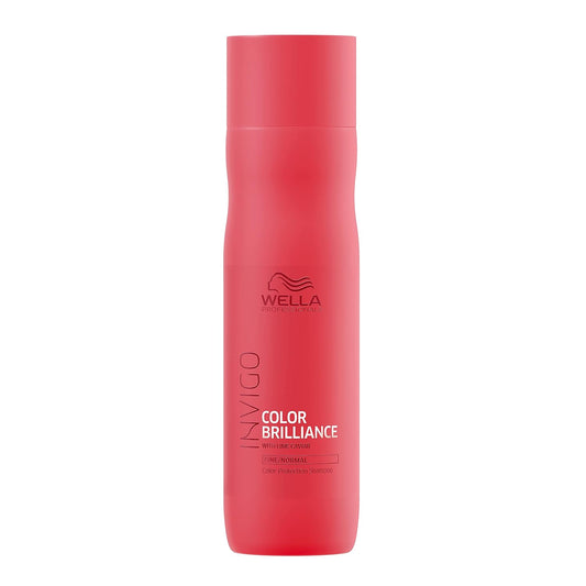 Red bottle of Wella Color Brilliance shampoo on a white background