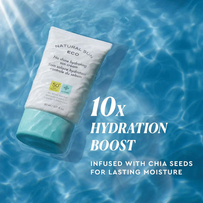 Sunscreen tube with water droplets on a blue water background, emphasizing hydration boost and chia seeds.