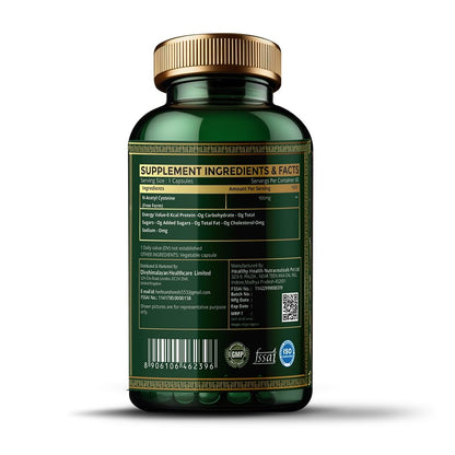 Green supplement bottle with gold cap on a white background