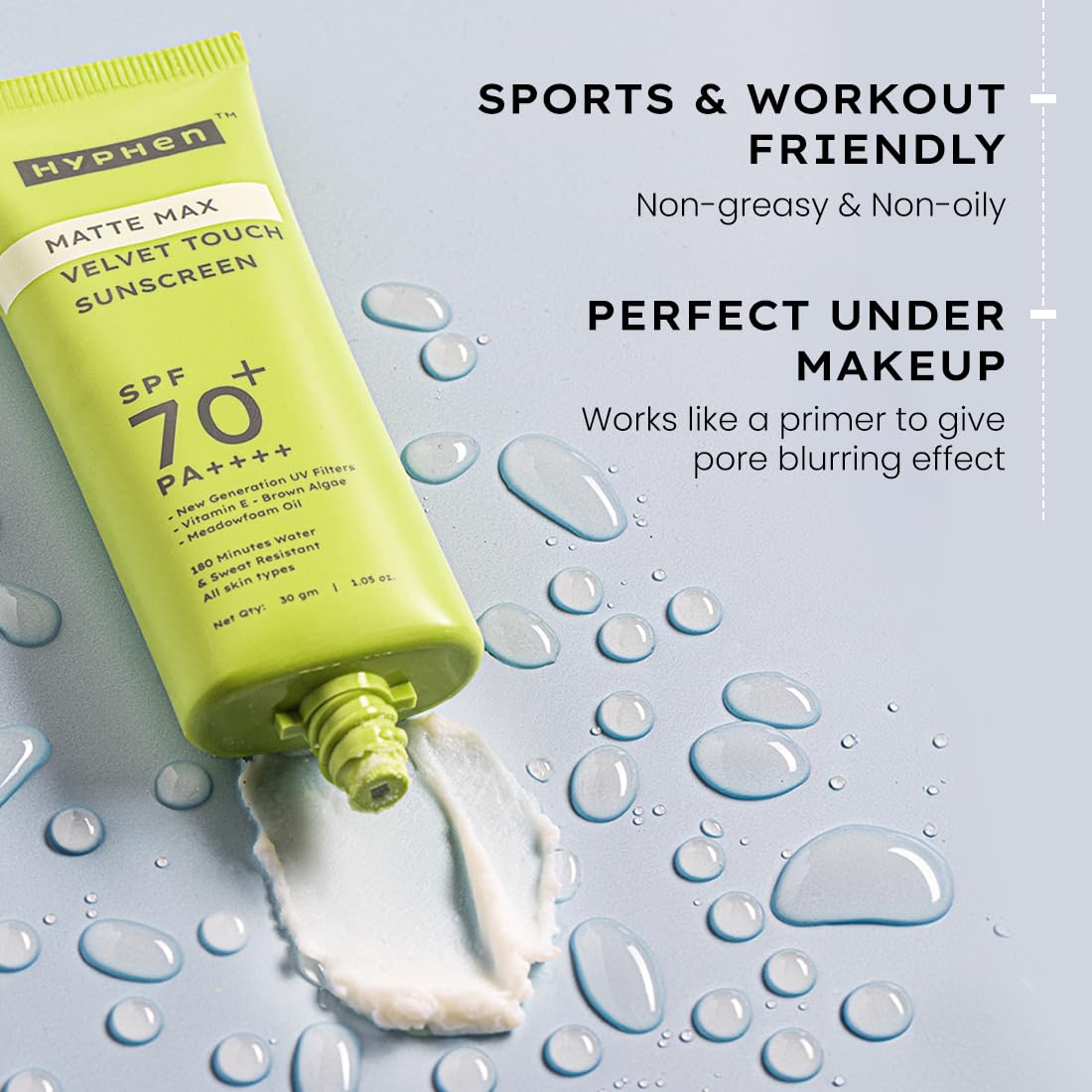 Green sunscreen tube with product details on a blue background