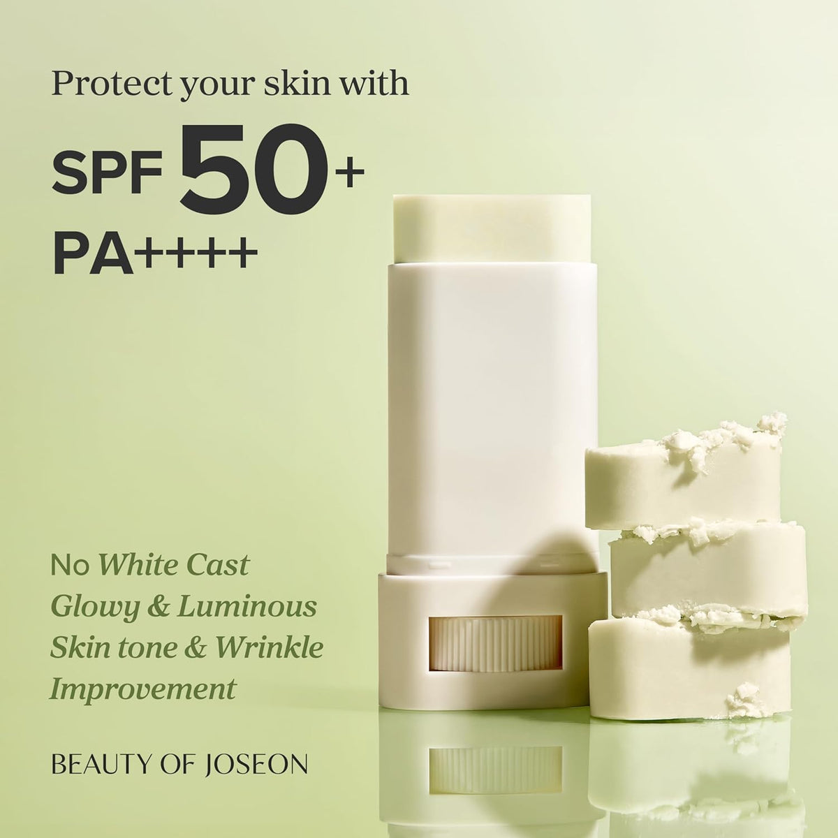 Cosmetic products with SPF 50+ text on a light green background