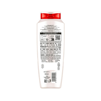 Back of a shampoo bottle with a red cap on a white background