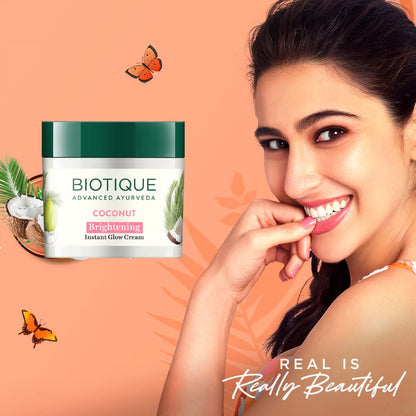 Biotique coconut cream jar with a woman smiling on an orange background