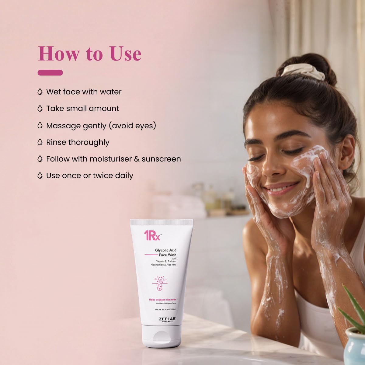 Woman applying facial cleanser with 1RX skincare product displayed, on a soft pink background.